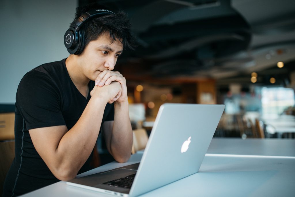 man in cafe with a laptop